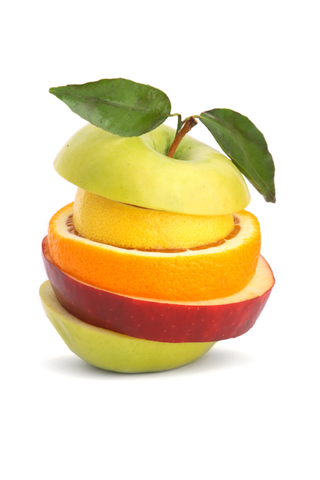 Montón de libros con una manzana encima